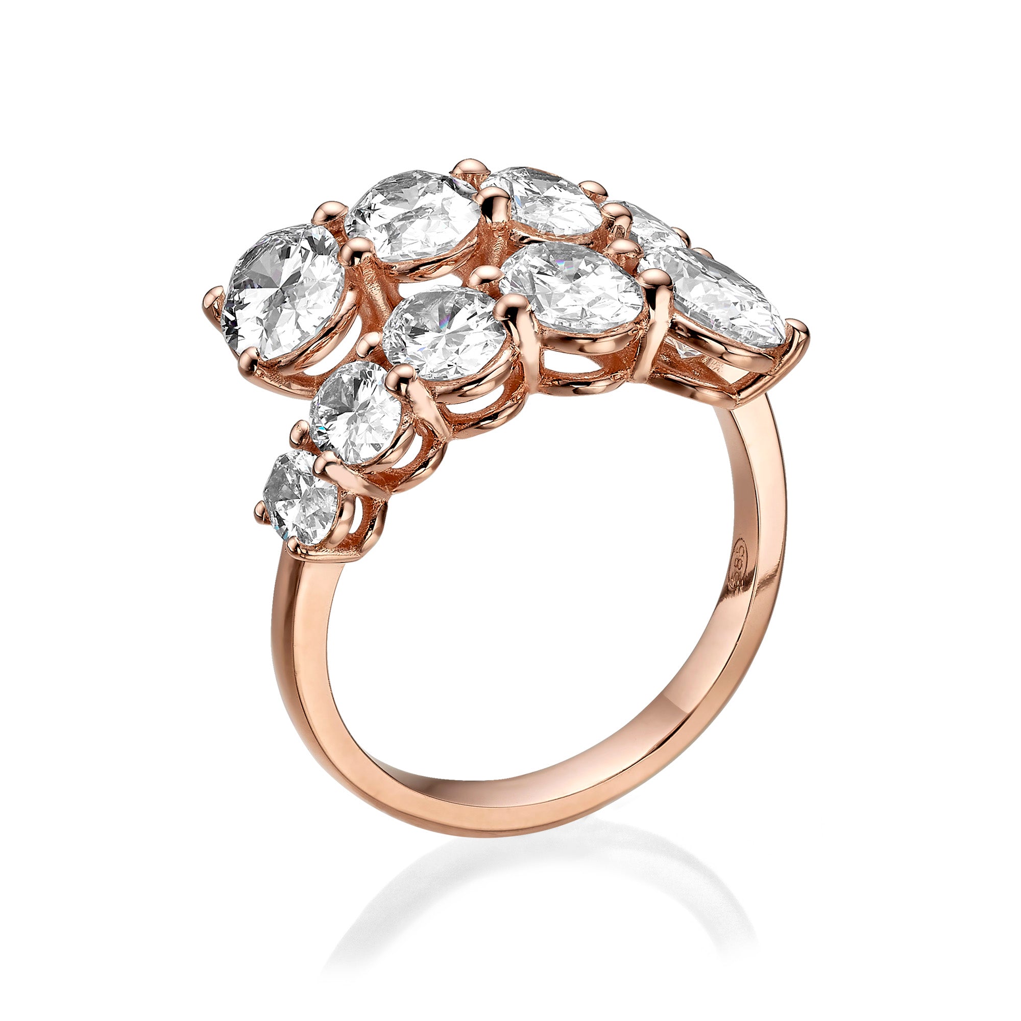 Rose gold ring with pear-shaped diamonds on a white background