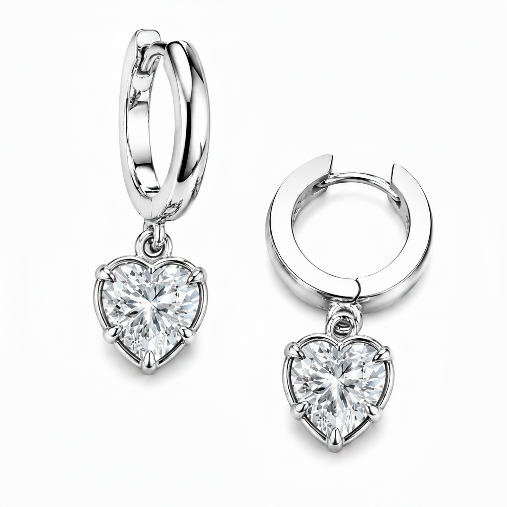 Silver hoop earrings with heart-shaped diamond pendants on a white background