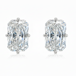 Pair of diamond earrings with rose gold settings on a white background