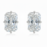Pair of diamond earrings with rose gold settings on a white background